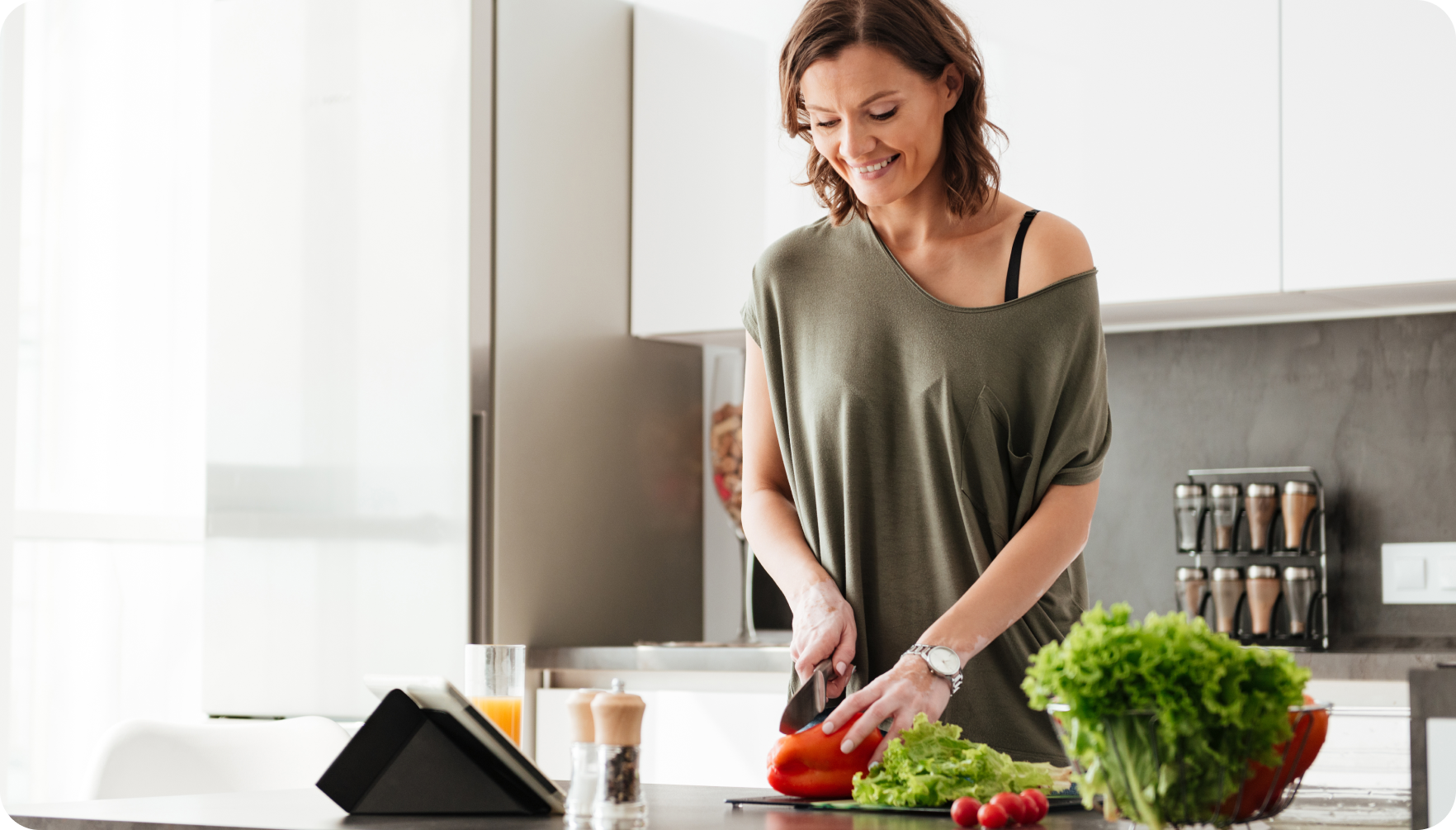 Woman cooking in a modern kitchen – KKT KOLBE